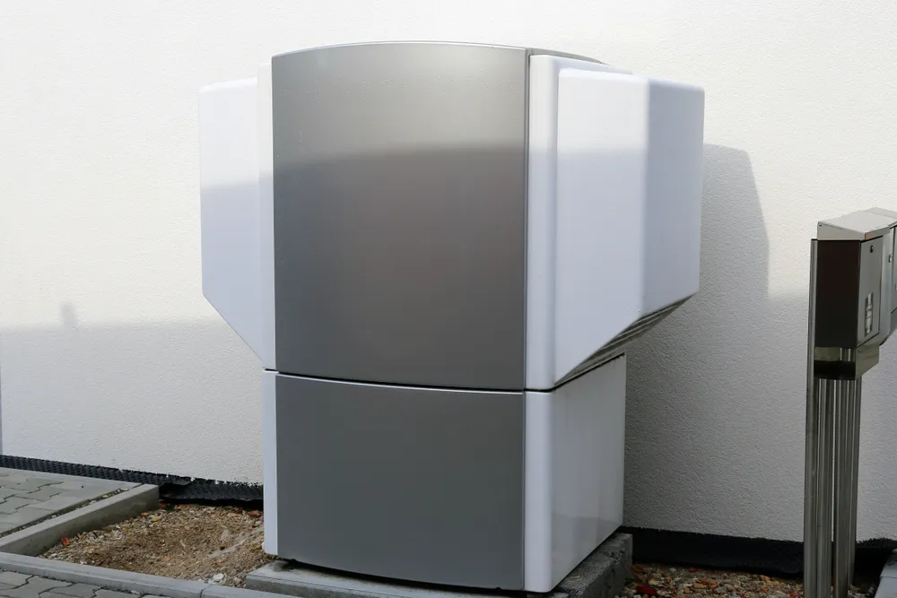 Heat pump unit installed outside, showcasing modern design and functionality, relevant to winter heating issues discussed in HVAC services.