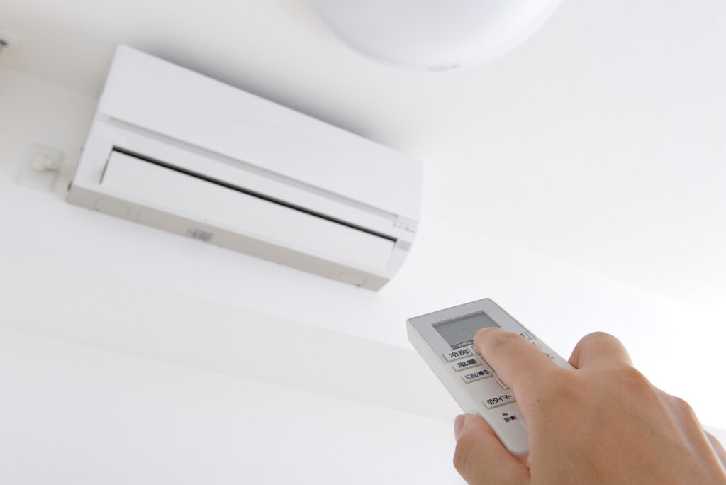 Turning AC up when not home with a remote control for energy savings. Air conditioning tips for home comfort | Accurate Air