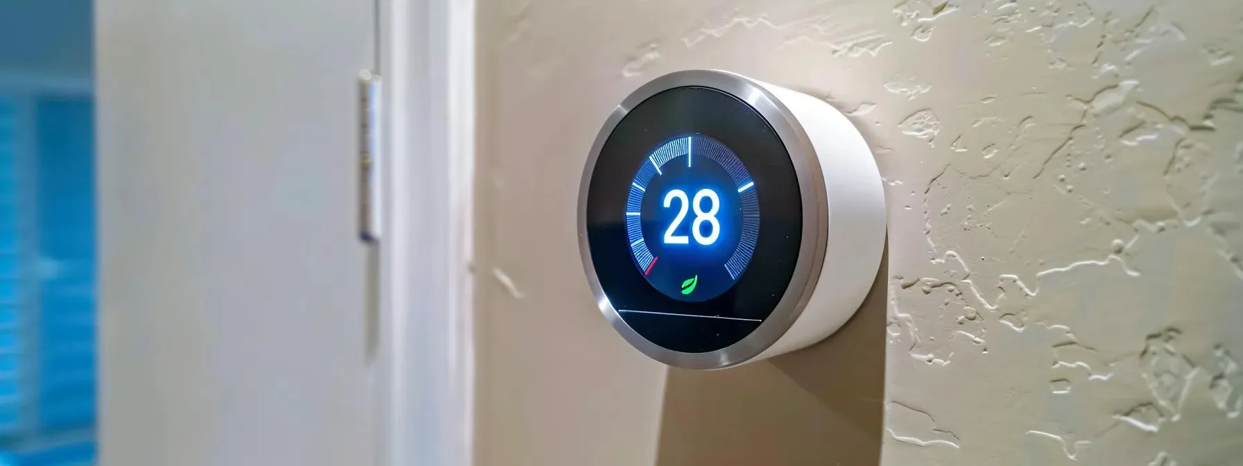 sleek smart thermostat on wall