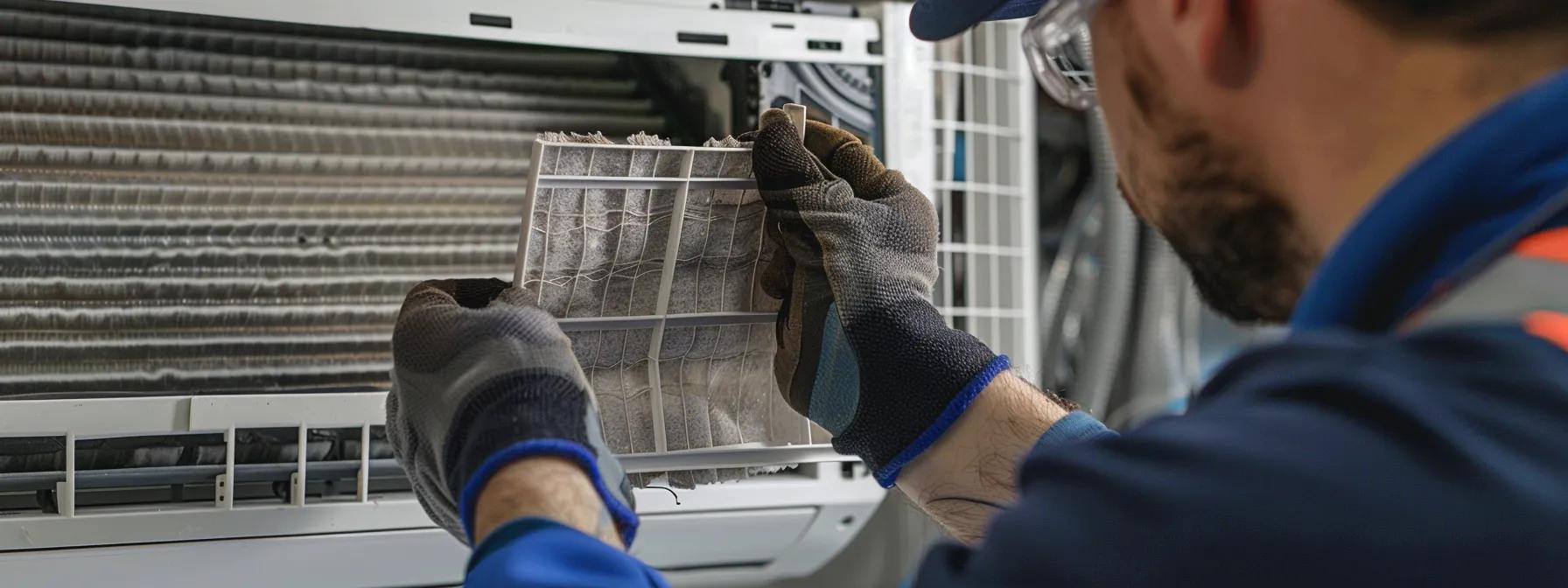 hVAC technician swapping a dusty air filter out