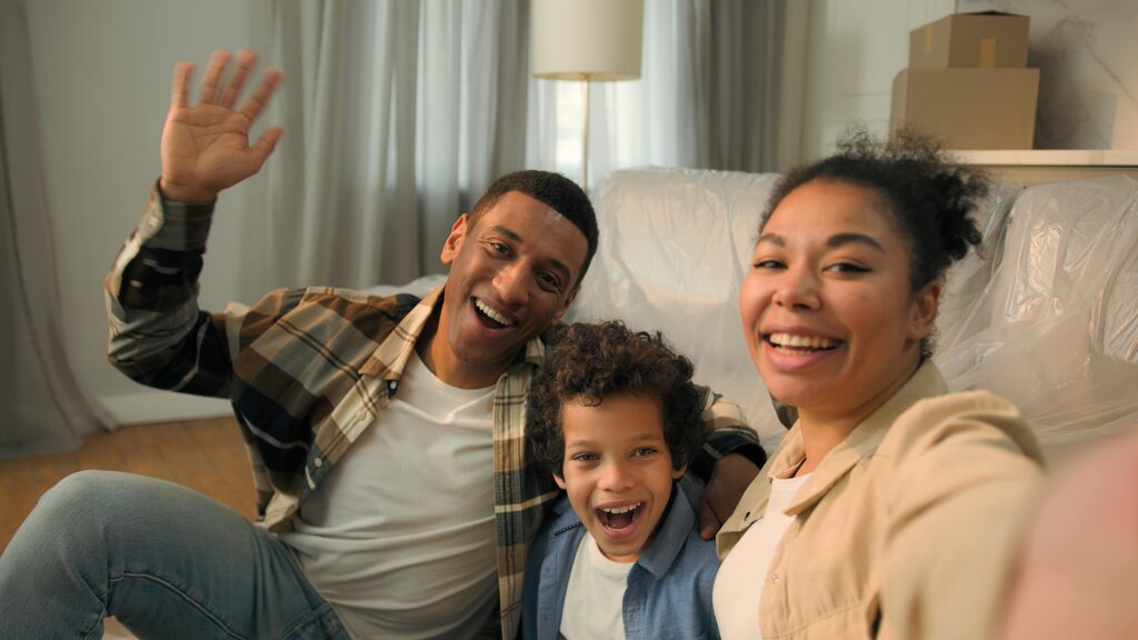 Happy family smiling in new home needing Furnace Maintenance in Tempe, AZ. Call for AC or Furnace repair | Accurate Air