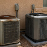 An old rusted air conditioner beside a new modern AC unit at a residential Tempe home for system replacement | Accurate Air